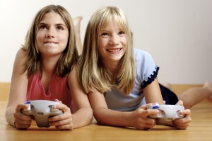 2 Girls playing video game